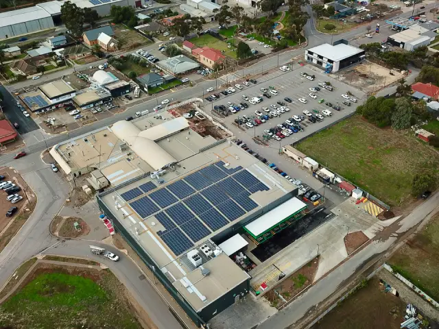 Wide-angle image of Virginia Shopping Centre with parking area